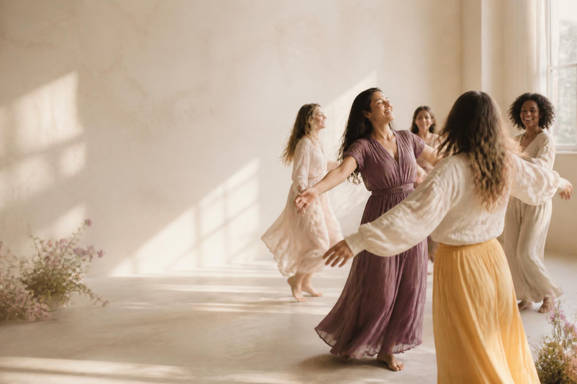 Women moving together in a bright, peaceful studio
